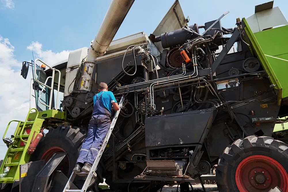 Combine Machine Service Mechanic Repairing Motor Outdoors